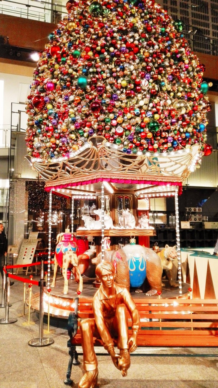 Tokyo area: Merry-go-round type Christmas tree with sculptures of famous skater (Hanyu Yuzuru).