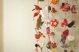 "Tsurushi-bina" is hanging small dolls made from clothes at red string in Dolls' festival.